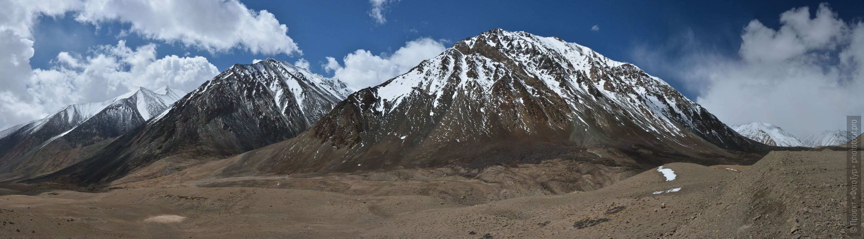 The road to Lake Pangong Tso from Leh, Ladakh. Tour Tibet Lakeside Advertising: Alpine lakes, geyser valley, Lamayuru, Colored Mountains, 01 - 10.09. 2023 year.