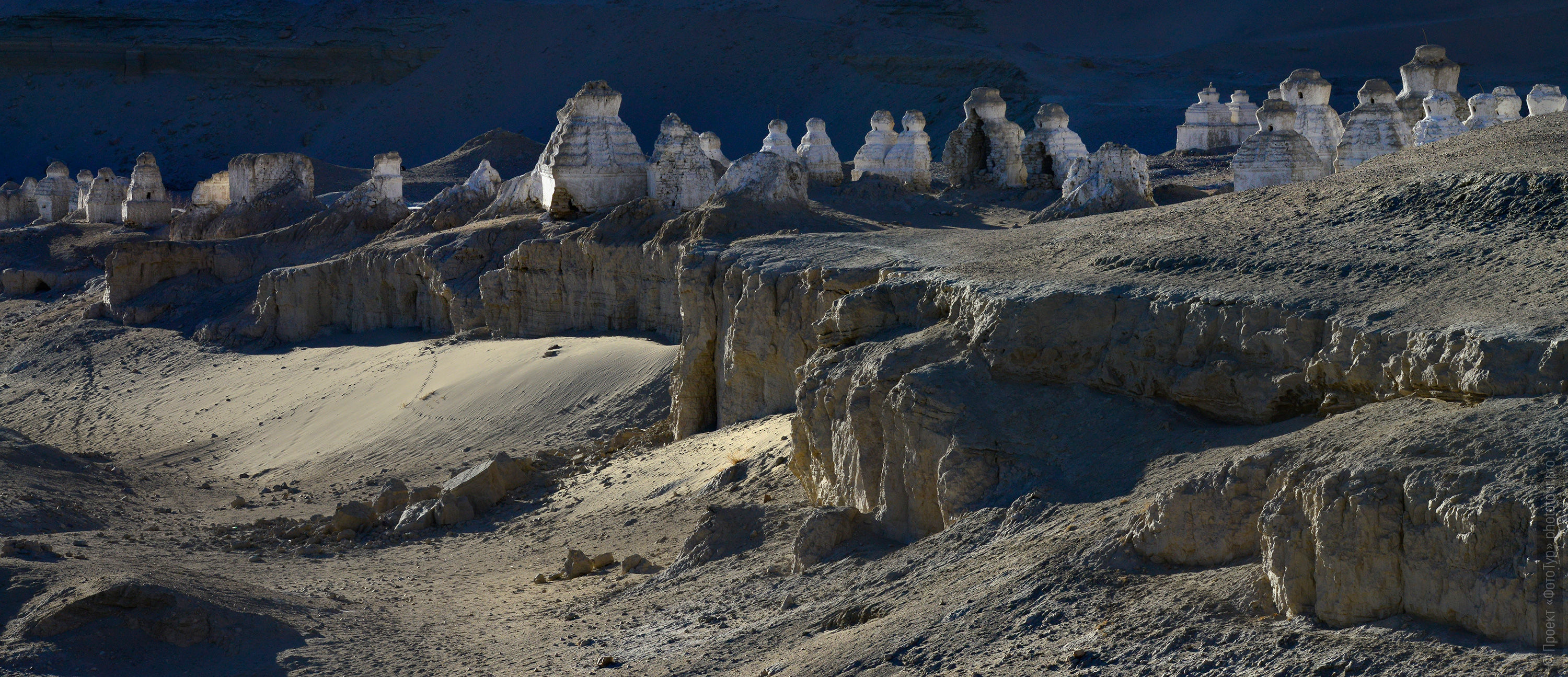 White stupas near the Shay Gonpa Buddhist monastery. Tour Tibet Lakeside Advertising: Alpine lakes, geyser valley, Lamayuru, Colored Mountains, 01 - 10.09. 2023 year.